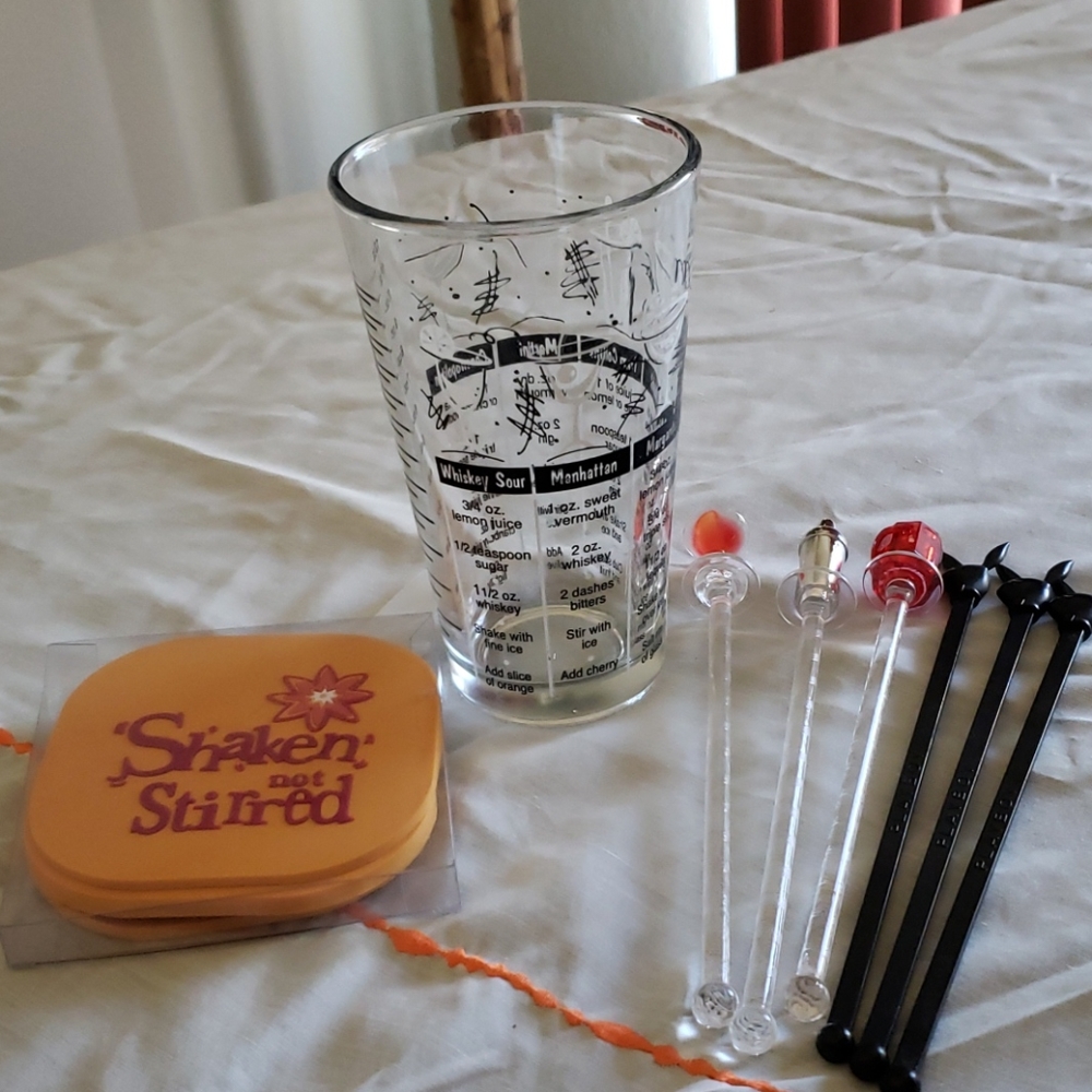 Coasters, Stirrers and Glass with Drink Recipes.